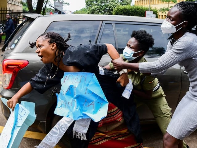ugandan riot police officers attempted to detain masaka district woman member of parliament joan namutaawe as female opposition legislators participate in a protest to ministry of internal affairs to deliver a petition over the brutality against them in kampala uganda photo reuters